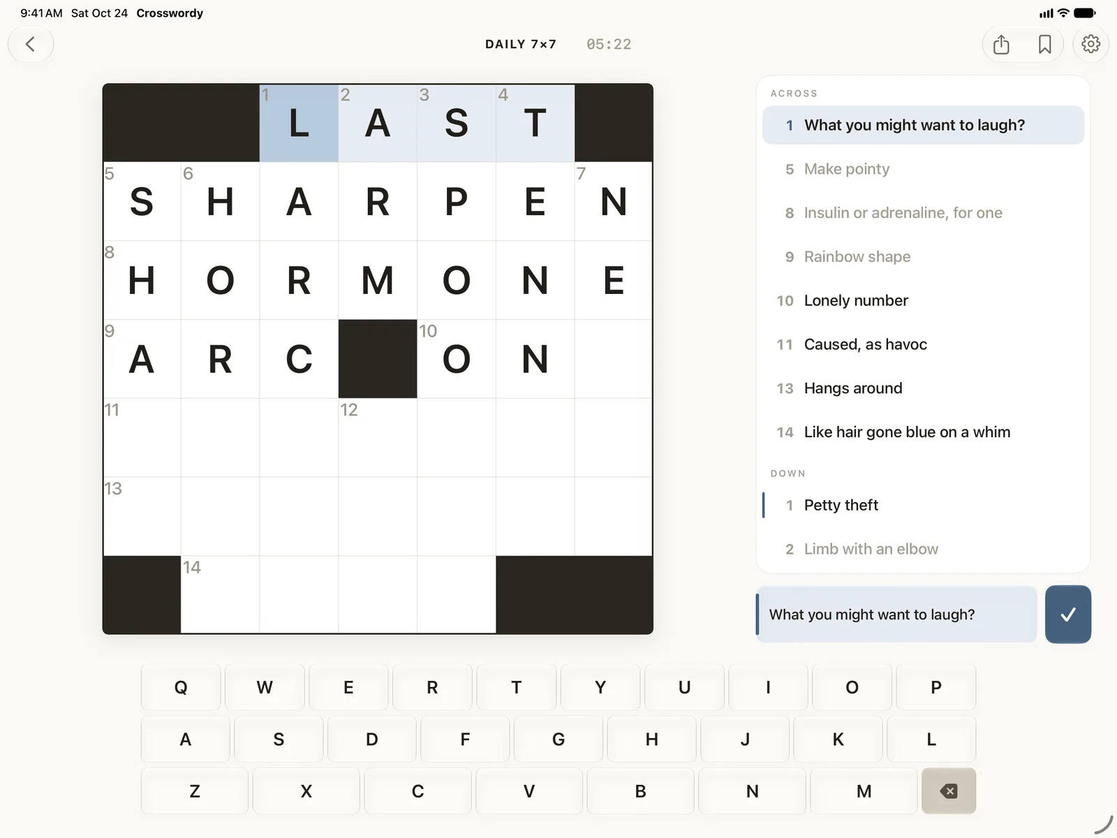 A crossword on iPad in landscape, with the whole clue list down the right of the grid and the keyboard below.